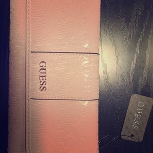 I am selling a Blush Guess Wallet brand new